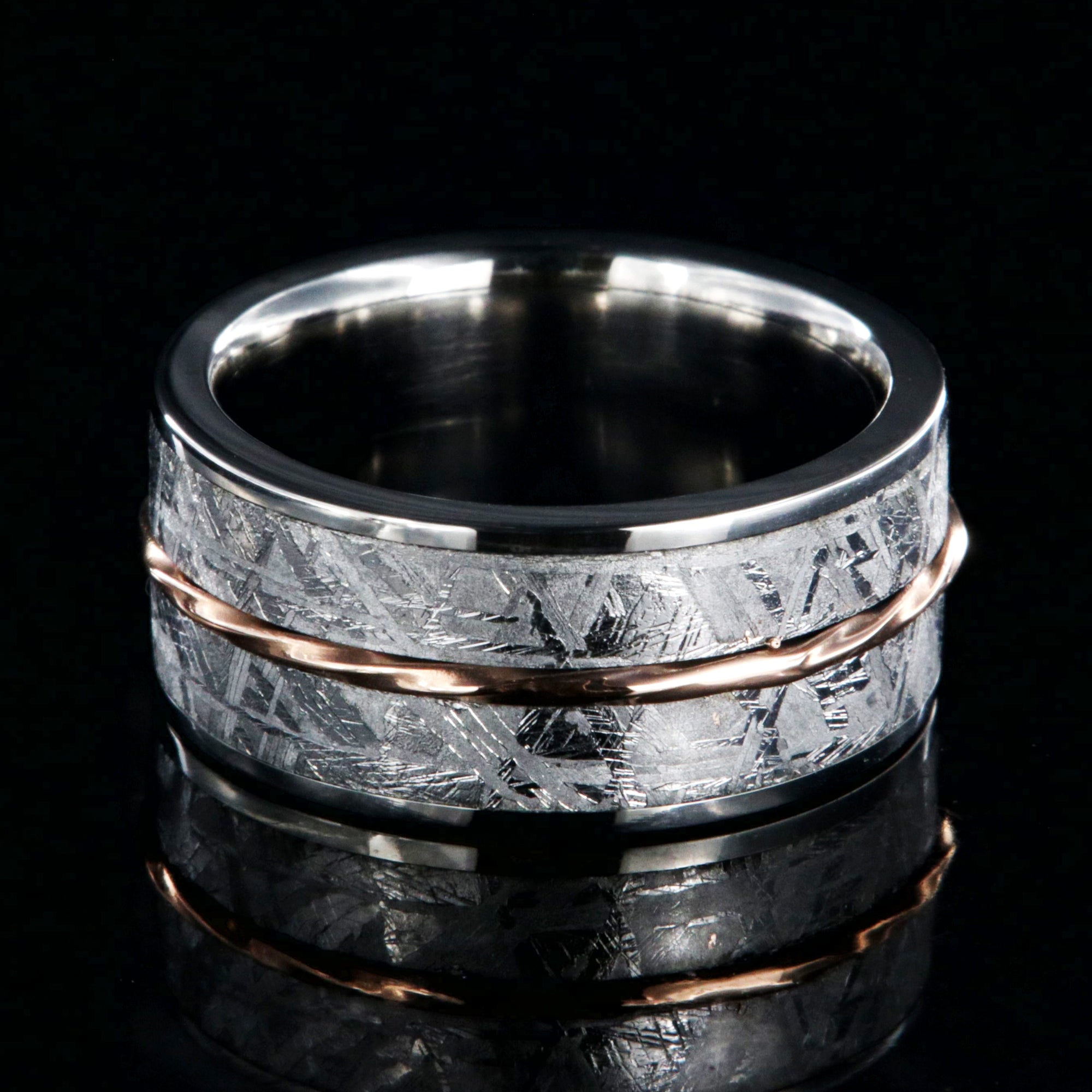 10mm wide titanium ring with Gibeon meteorite and a twisted rose gold center inlay