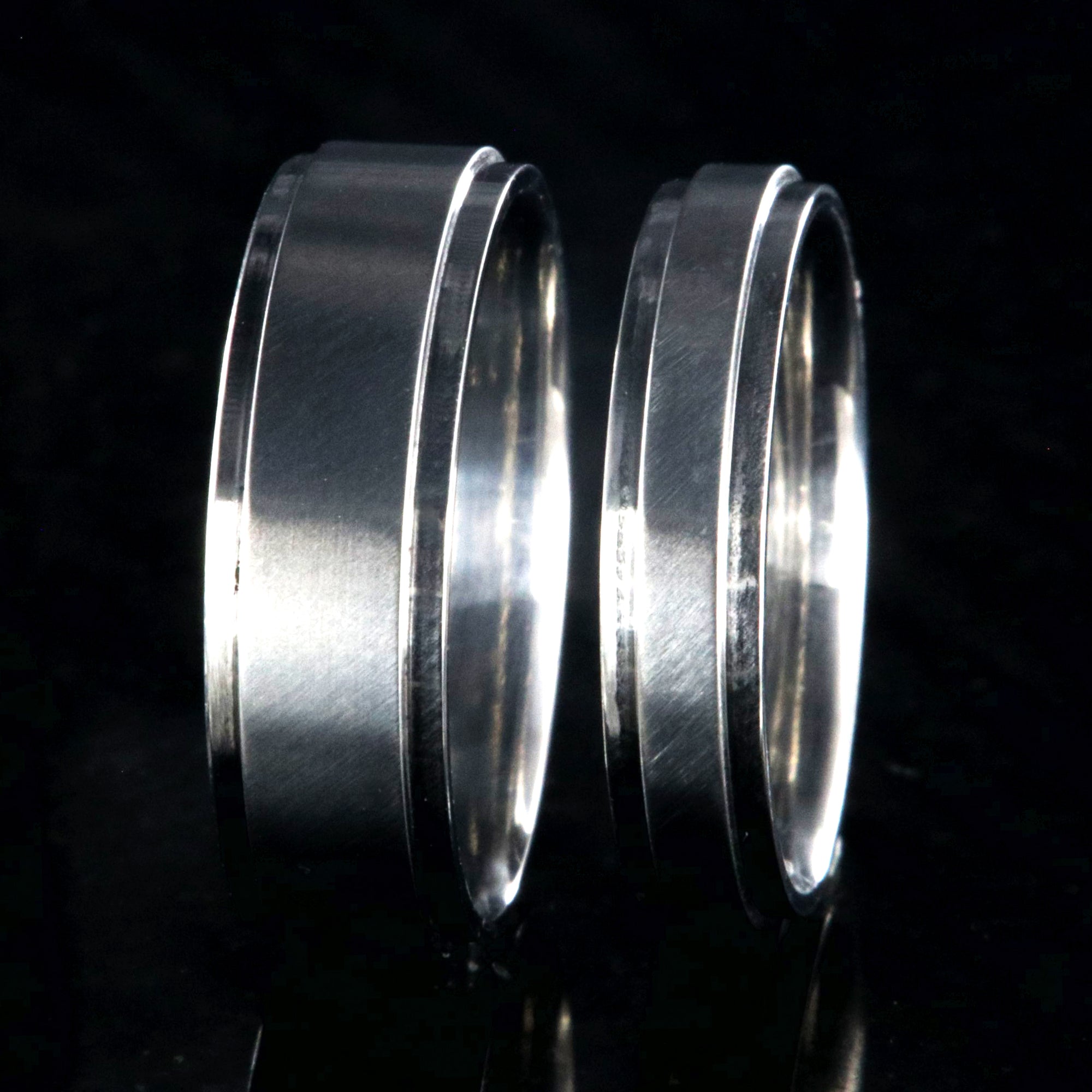 6mm and 4mm wide matching titanium wedding bands with raised centers