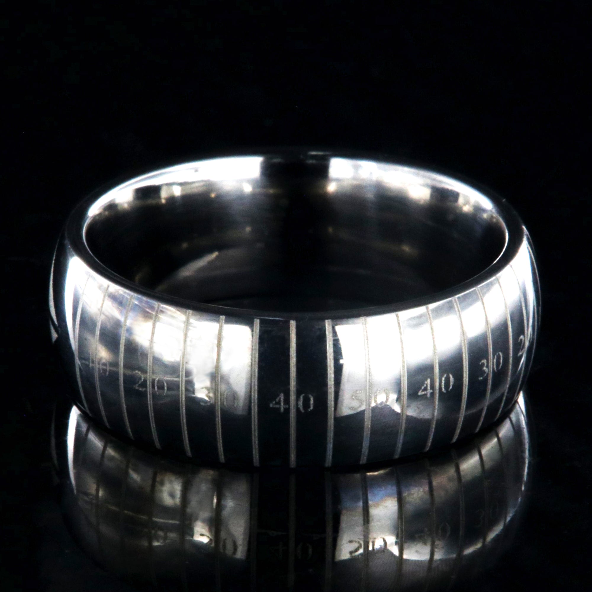 8mm wide titanium football ring with layered football design 