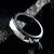 6mm wide men's meteorite wedding band with a raised center and black zirconium step edges and sleeve