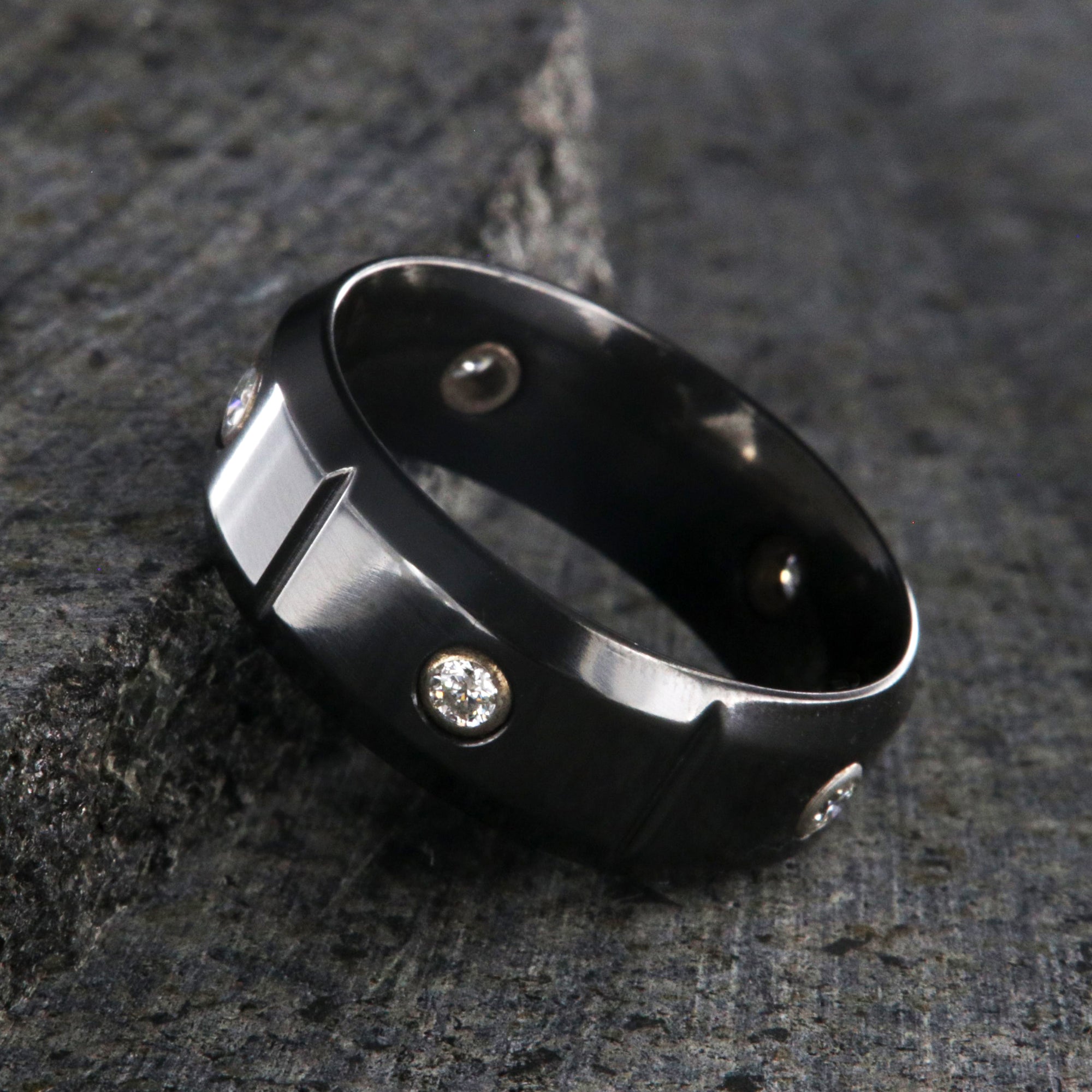 8mm wide black zirconium wedding band with 5 diamonds, beveled edges, and vertical grooves