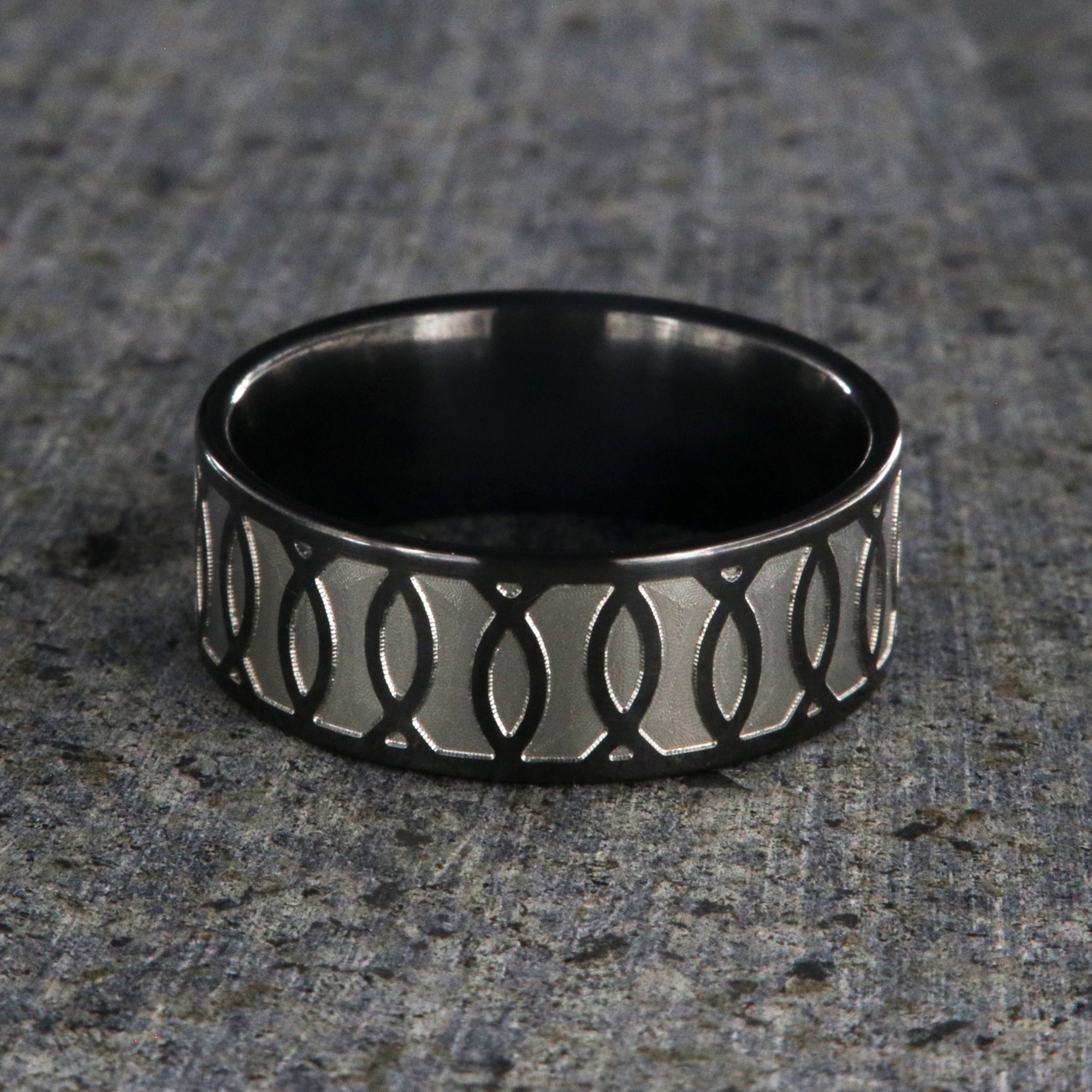 8mm wide black zirconium ring with a Jesus fish design
