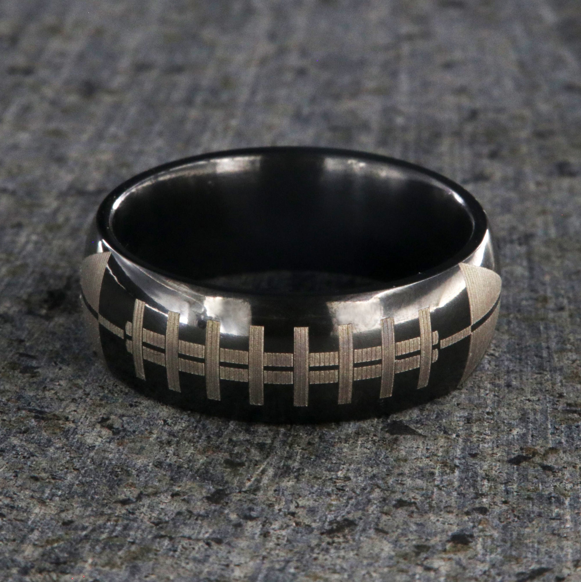 8mm wide black zirconium ring with football design