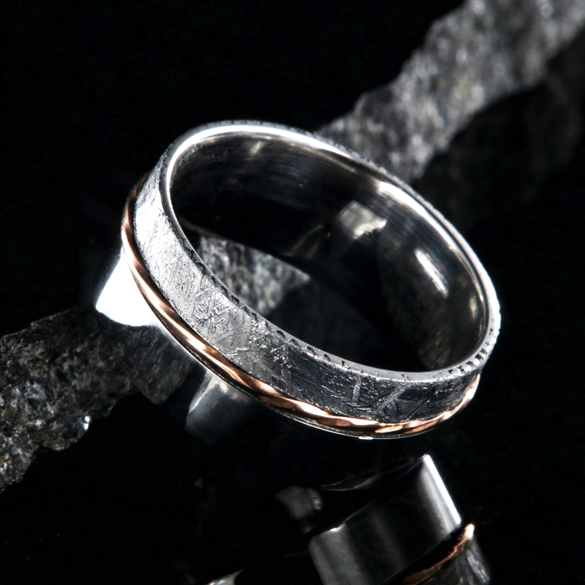 10mm wide wedding band with a wide polished cobalt edge, a centered twisted rose gold inlay, and narrow Gibeon meteorite edge