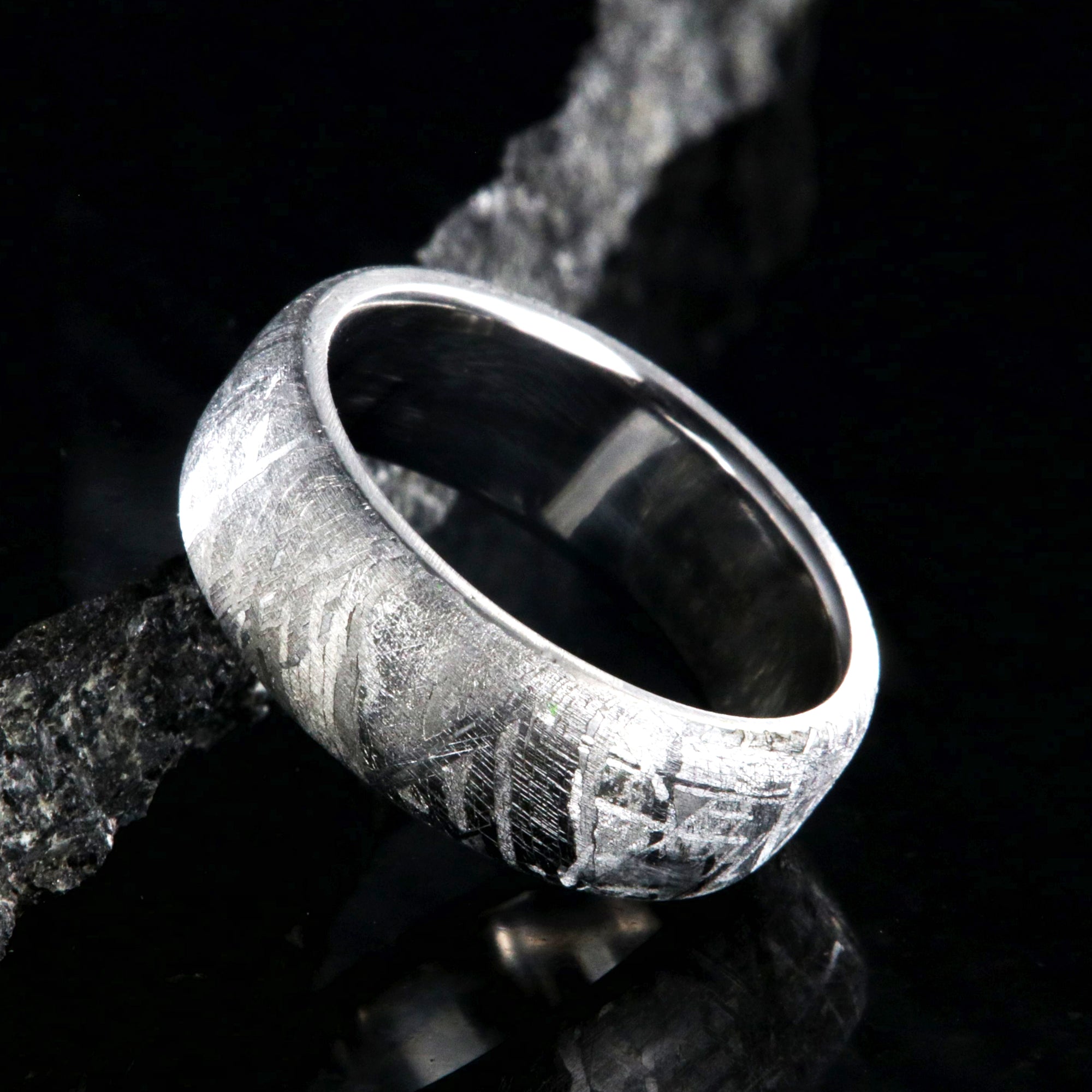 7mm wide Gibeon meteorite wedding band with a cobalt sleeve and rounded profile