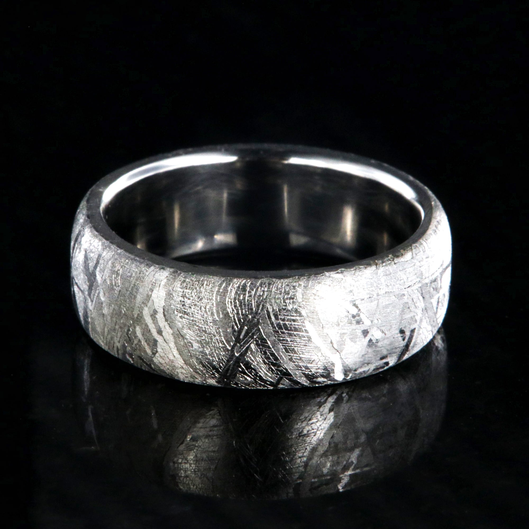 7mm wide Gibeon meteorite wedding band with a cobalt sleeve and rounded profile