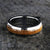 6mm wide wedding band with a whiskey barrel inlay and titanium edges and a rounded profile