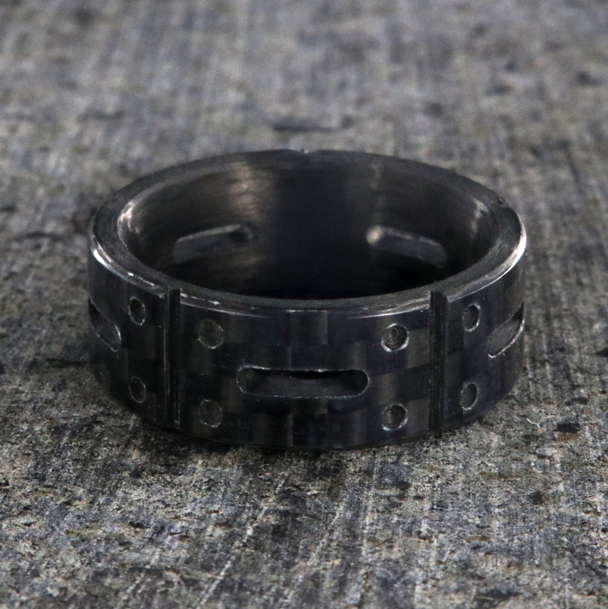 8mm wide black carbon fiber ring with a carved matrix pattern