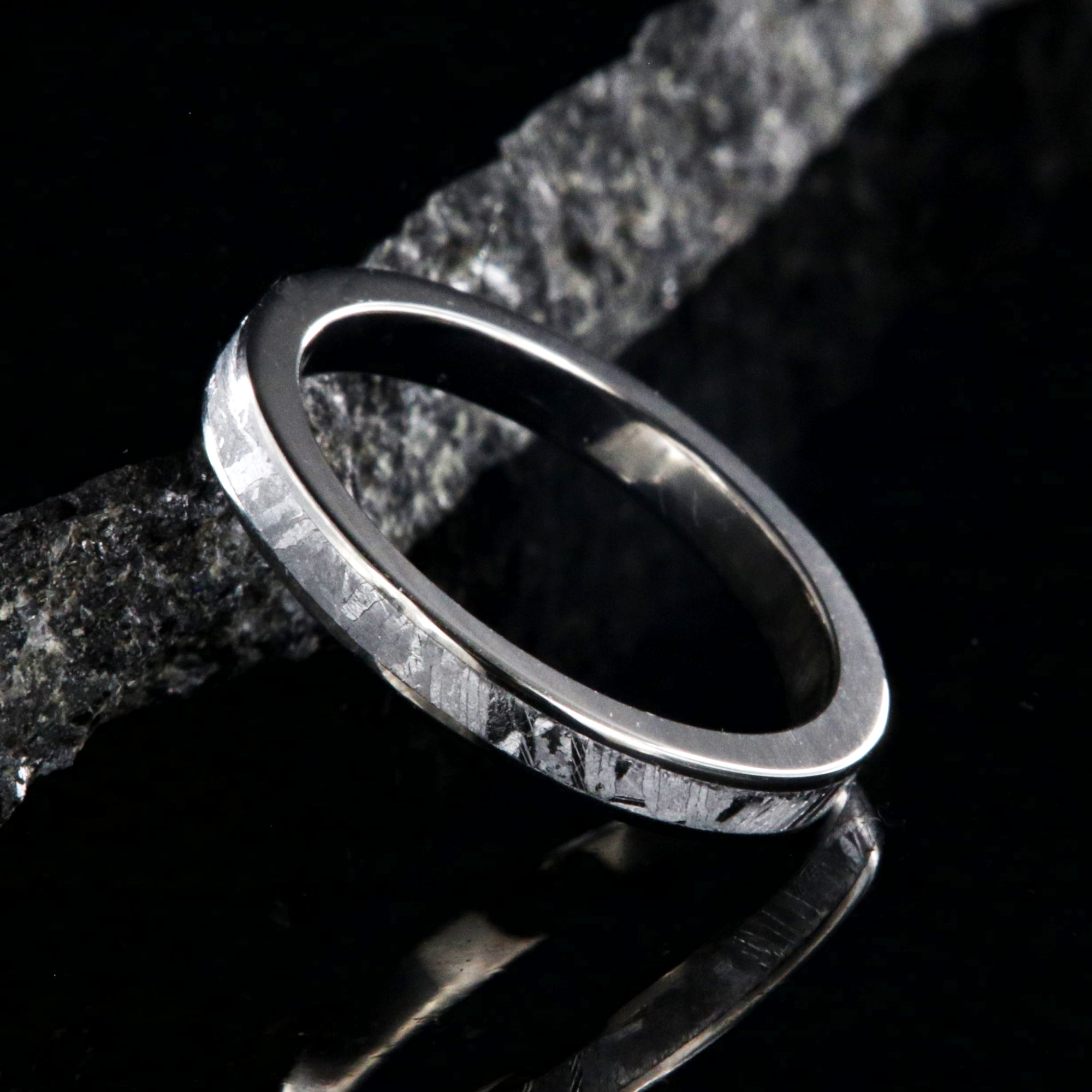 3mm wide women's meteorite wedding band with titanium edges and sleeve