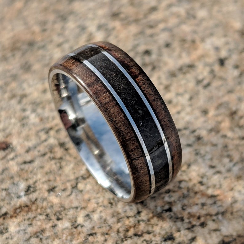8mm wide cobalt wedding band with Arizona ironwood edges, a dinosaur bone inlay, and a rounded profile