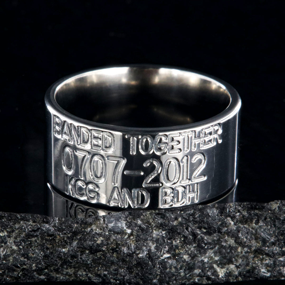 10mm wide titanium duck band wedding ring with polished finish, flat profile, and 3 lines of personalized text