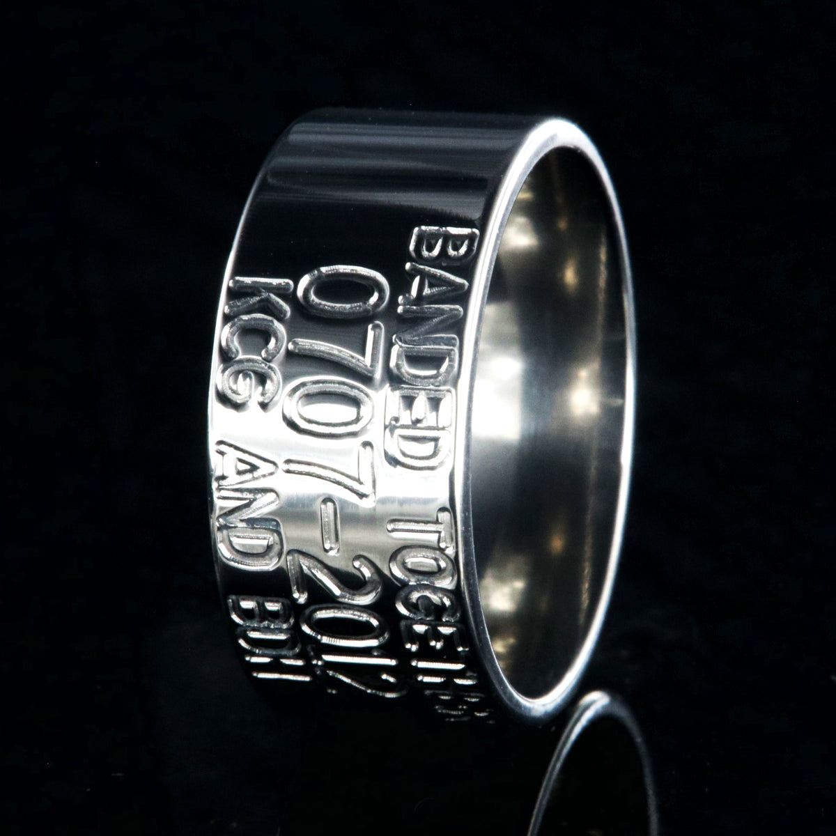 10mm wide titanium duck band wedding ring with polished finish, flat profile, and 3 lines of personalized text