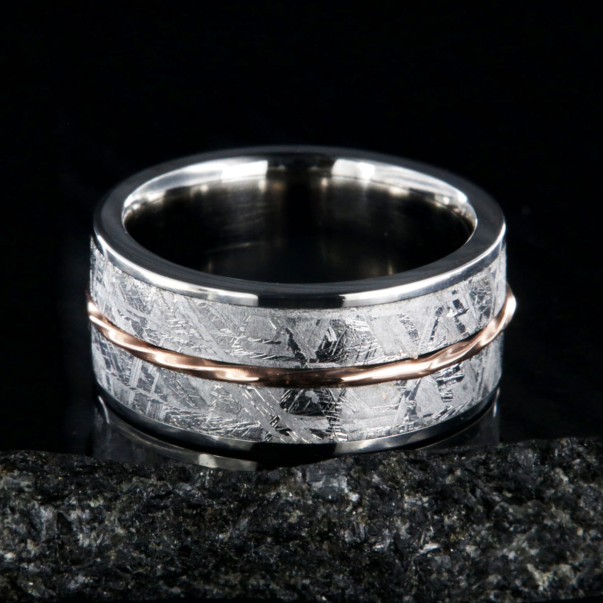 10mm wide titanium ring with Gibeon meteorite and a twisted rose gold center inlay