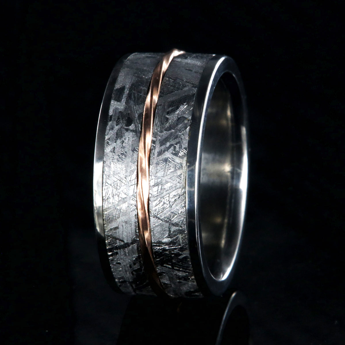 10mm wide titanium ring with Gibeon meteorite and a twisted rose gold center inlay