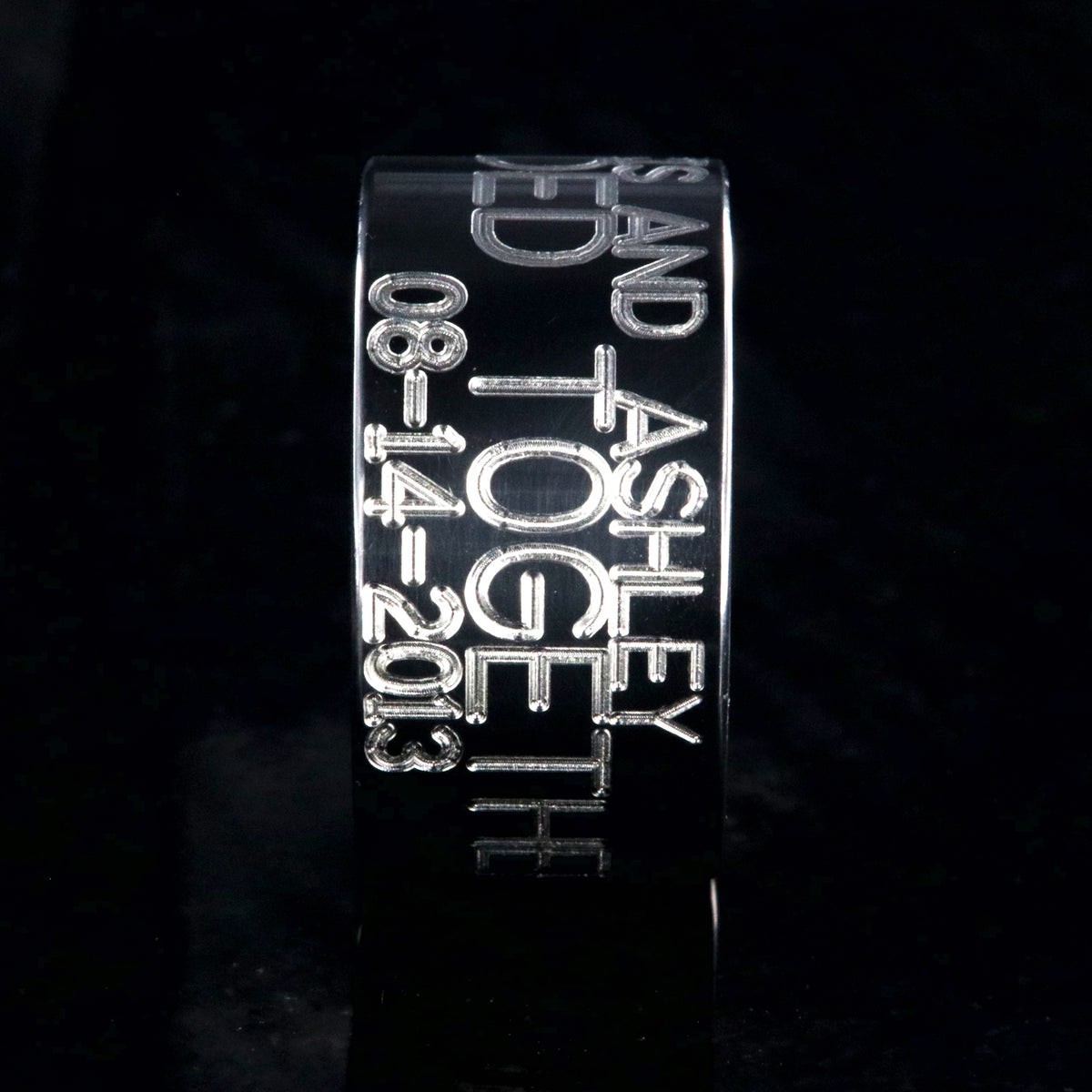 12mm wide black zirconium duck band ring; polished black appearance with 3 lines of two-toned personalized text
