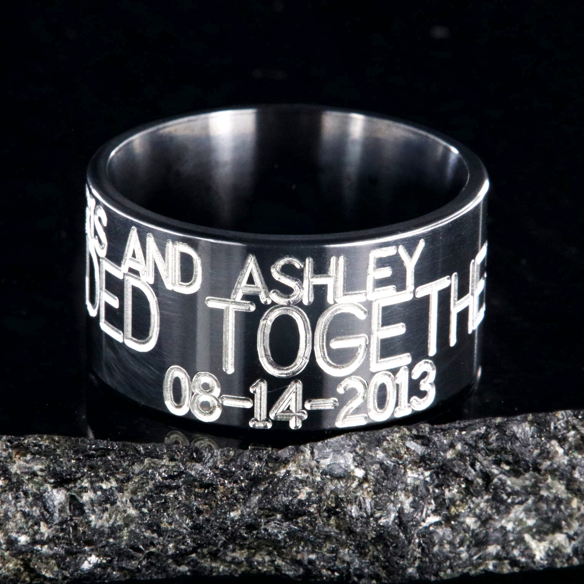 12mm wide black zirconium duck band ring; polished black appearance with 3 lines of two-toned personalized text
