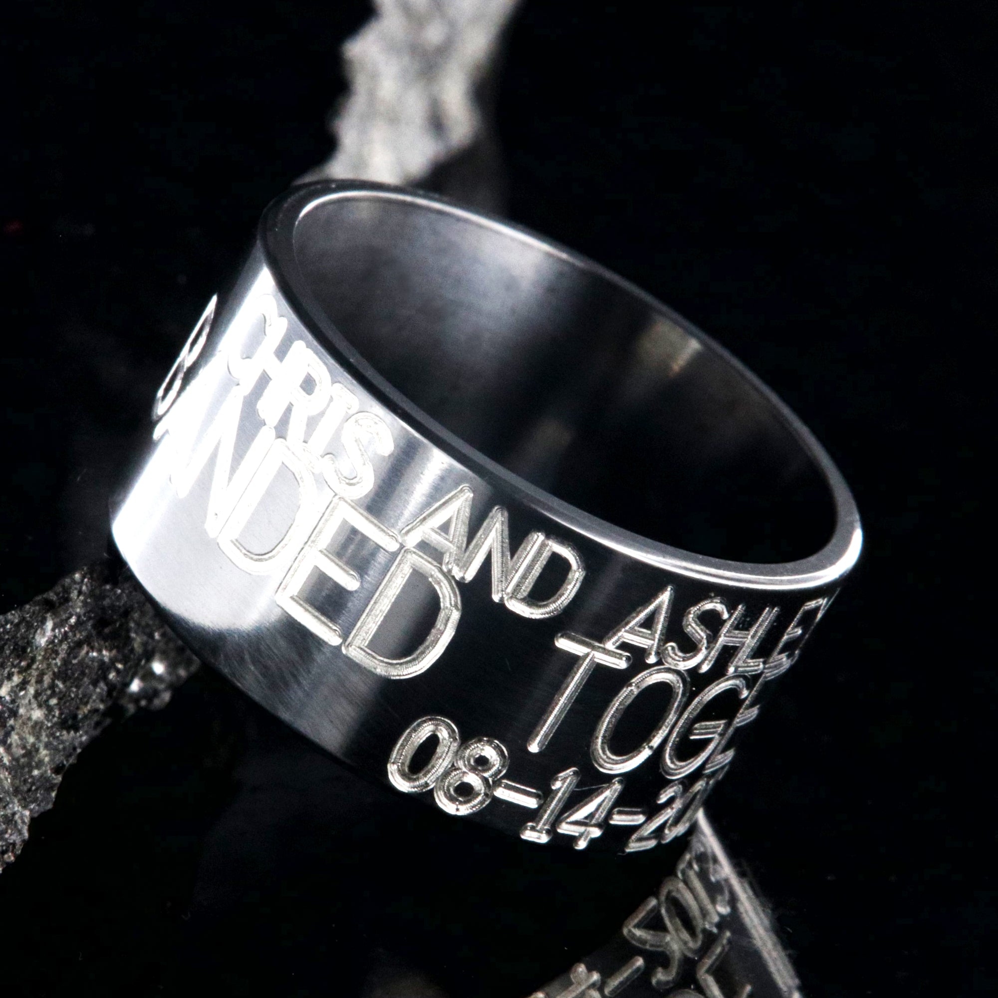 12mm wide black zirconium duck band ring; polished black appearance with 3 lines of two-toned personalized text