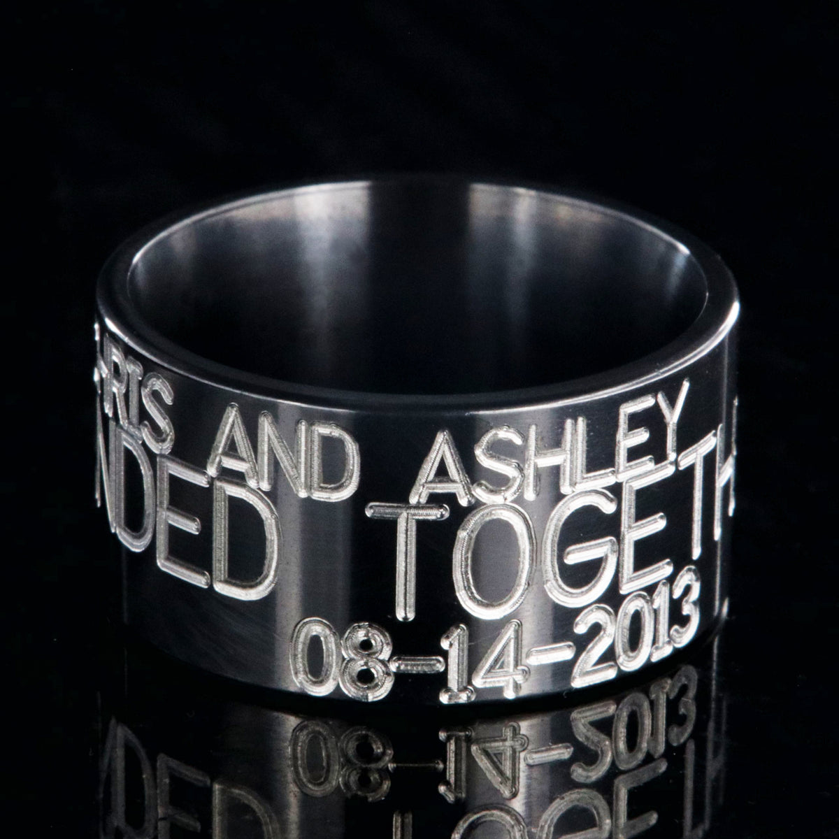 12mm wide black zirconium duck band ring; polished black appearance with 3 lines of two-toned personalized text