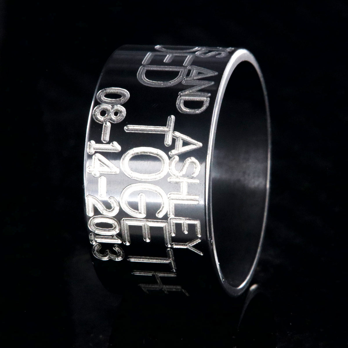 12mm wide black zirconium duck band ring; polished black appearance with 3 lines of two-toned personalized text