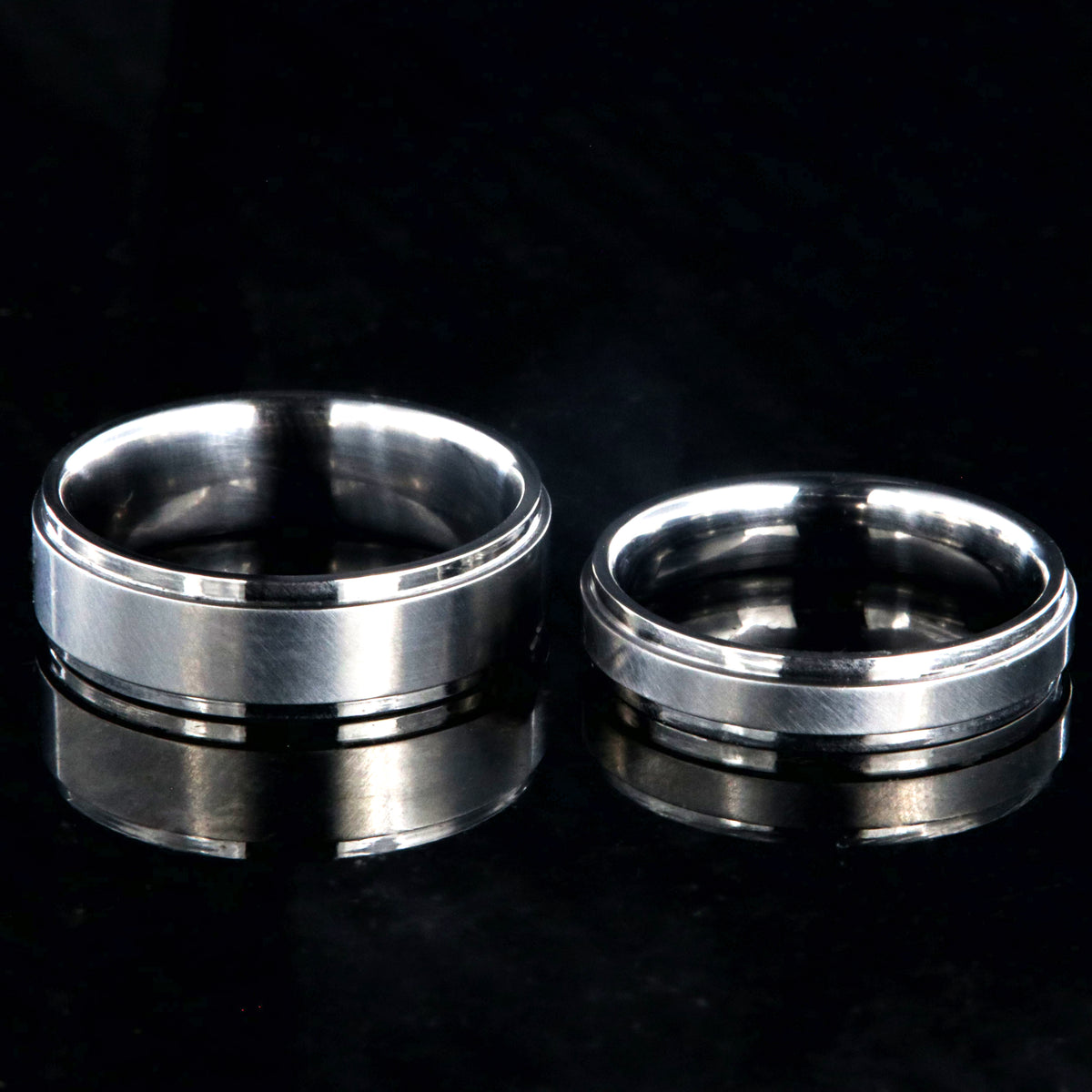 6mm and 4mm wide matching titanium wedding bands with raised centers