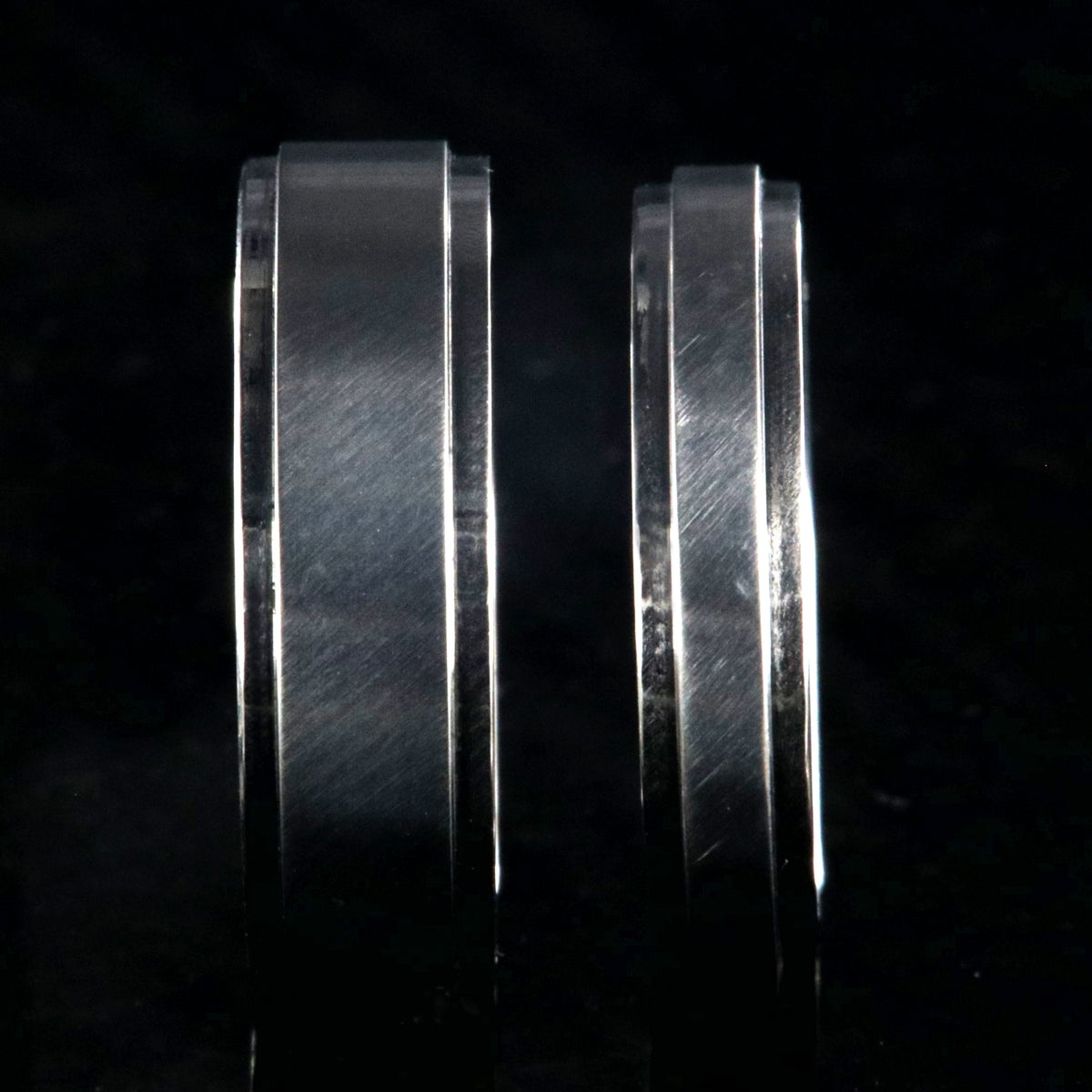 6mm and 4mm wide matching titanium wedding bands with raised centers