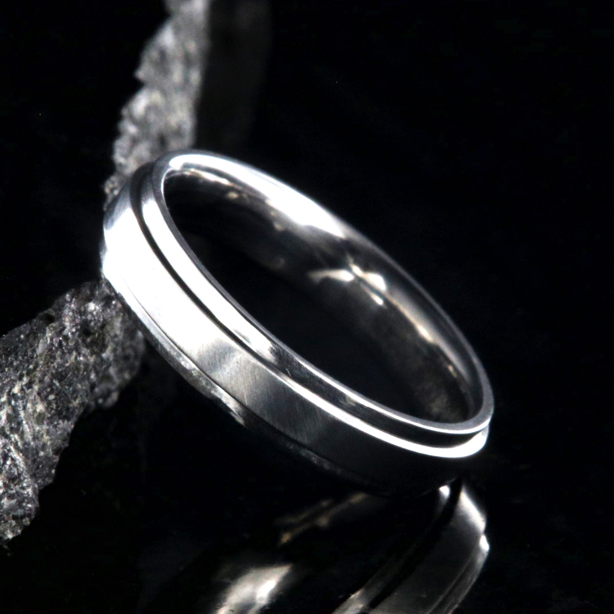 4mm wide titanium wedding band with a raised center