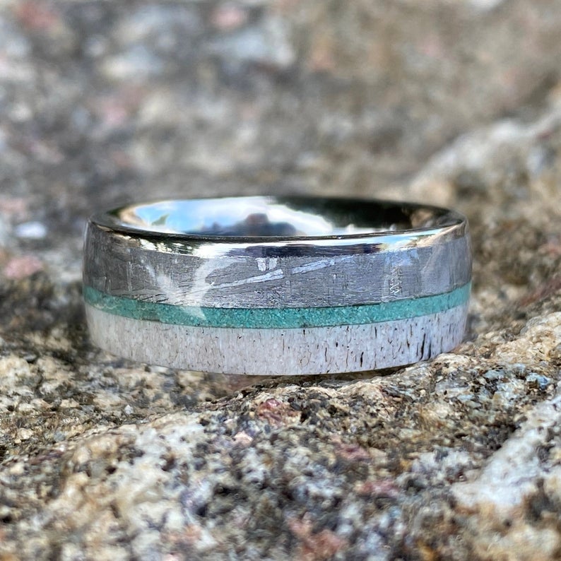 8mm wide men's wedding ring with a thin turquoise center inlay, a Gibeon meteorite edge, and an antler edge