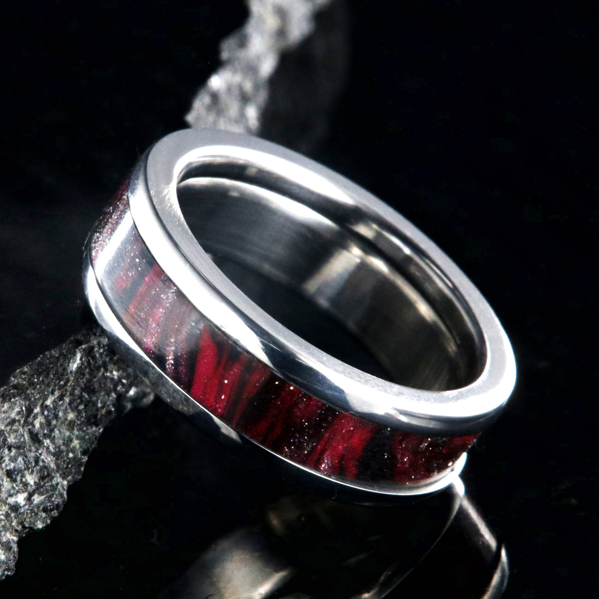 6mm wide titanium ring with pink and black swirl patterned inlay