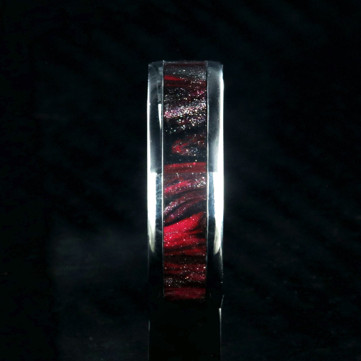 6mm wide titanium ring with pink and black swirl patterned inlay