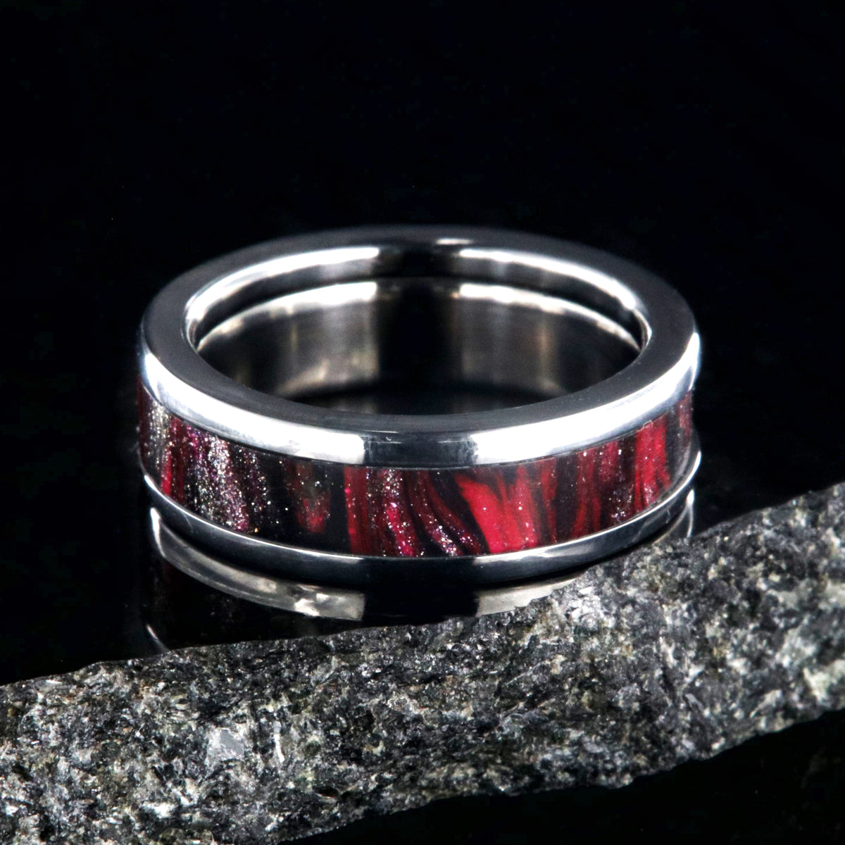 6mm wide titanium ring with pink and black swirl patterned inlay