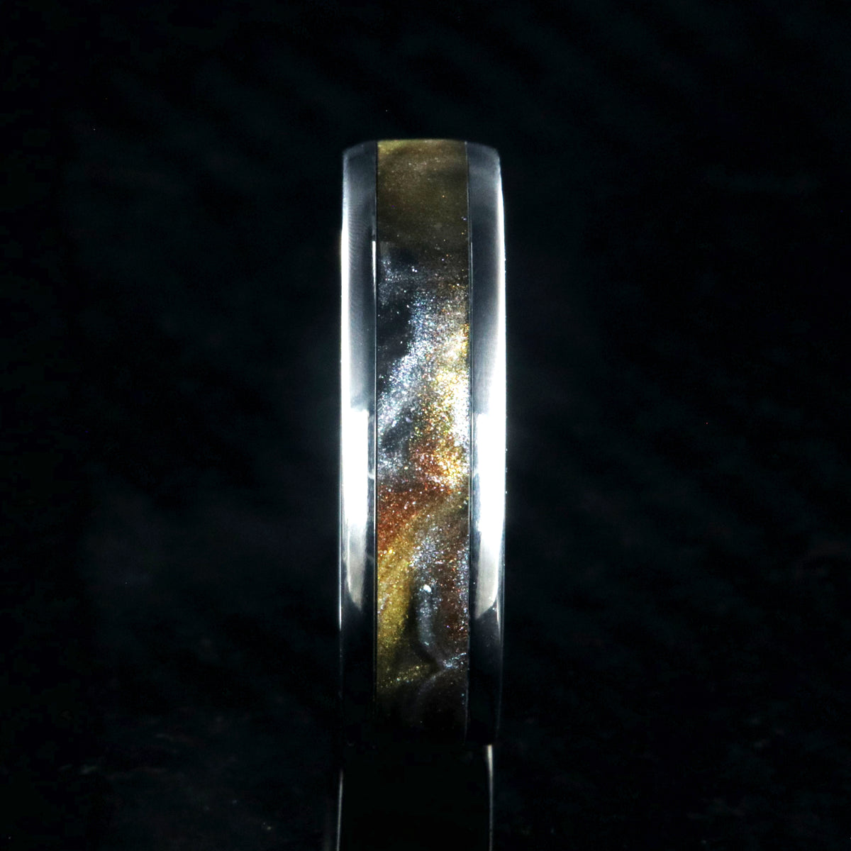6mm wide titanium ring with a gold, black, and silver inlay