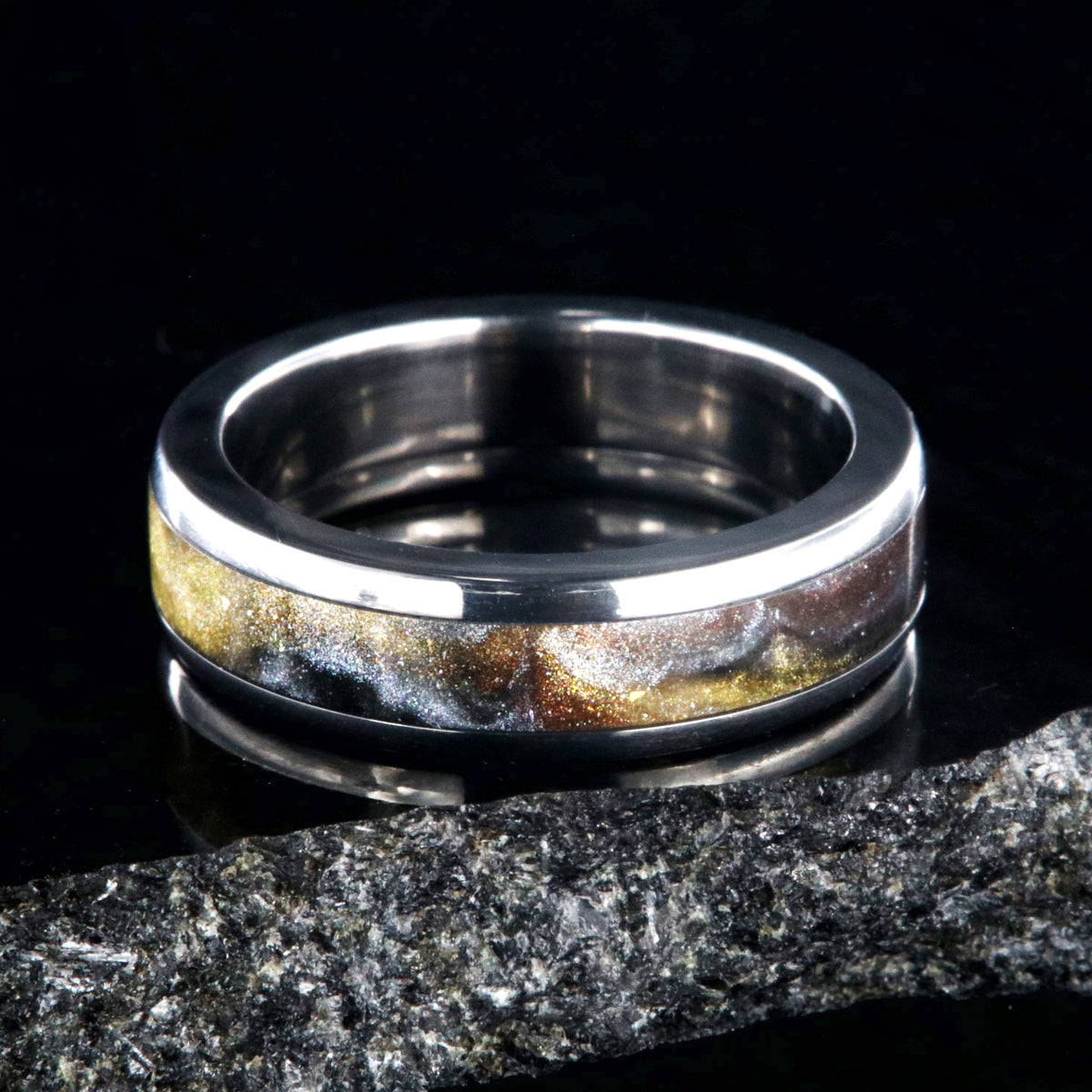 6mm wide titanium ring with a gold, black, and silver inlay
