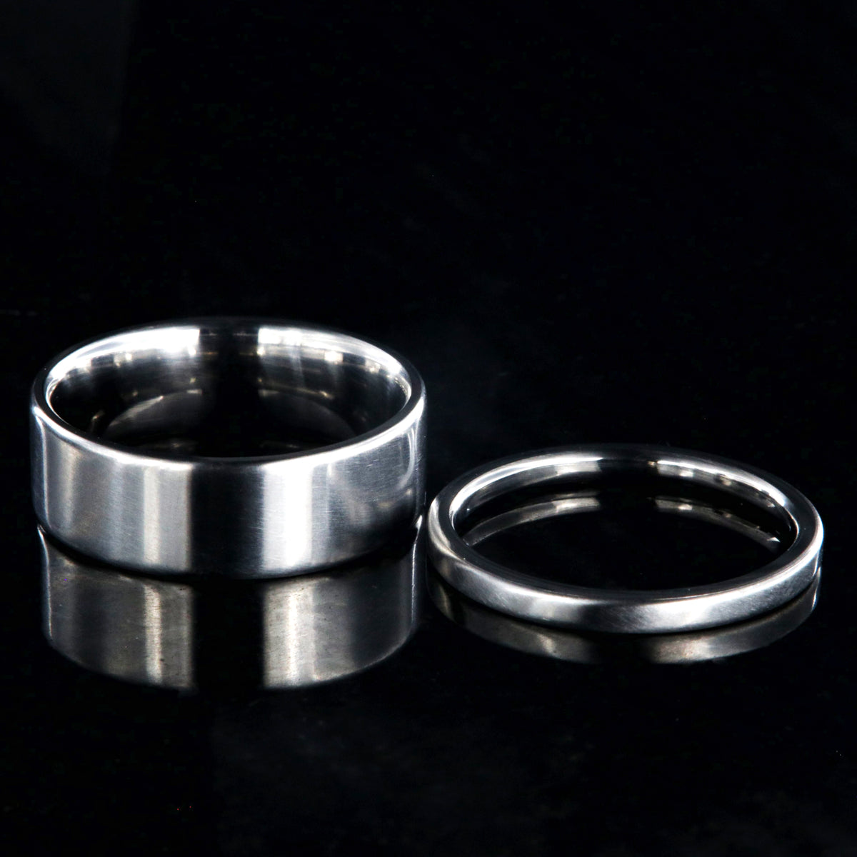 7mm and 2mm wide matching titanium wedding band set with a flat profile