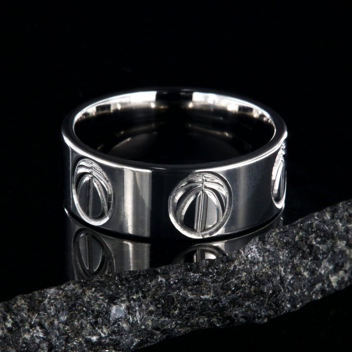 8mm wide titanium volleyball ring with a milled volleyball design