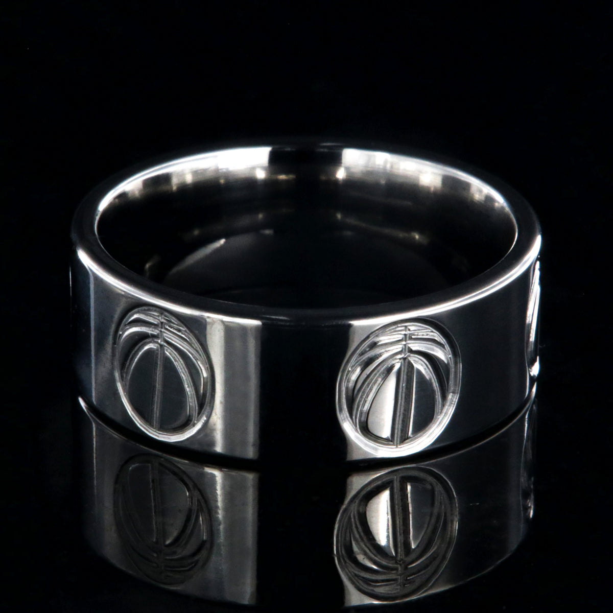 8mm wide titanium volleyball ring with a milled volleyball design
