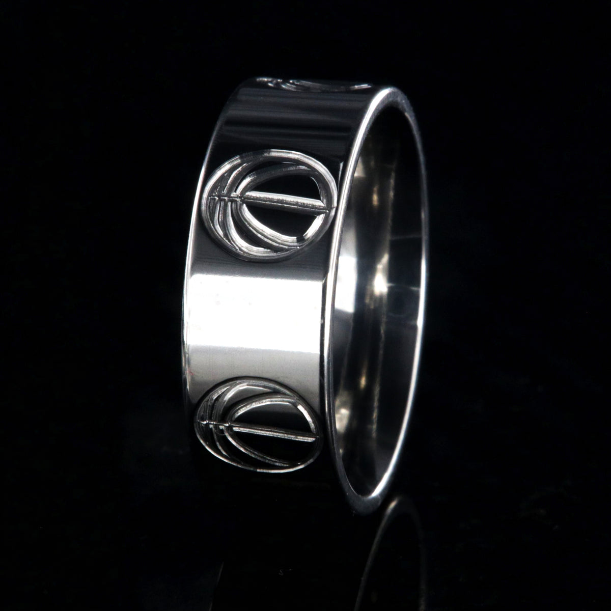 8mm wide titanium volleyball ring with a milled volleyball design