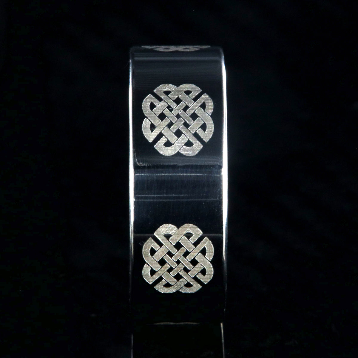 8mm wide titanium ring with Celtic love knot and flat profile