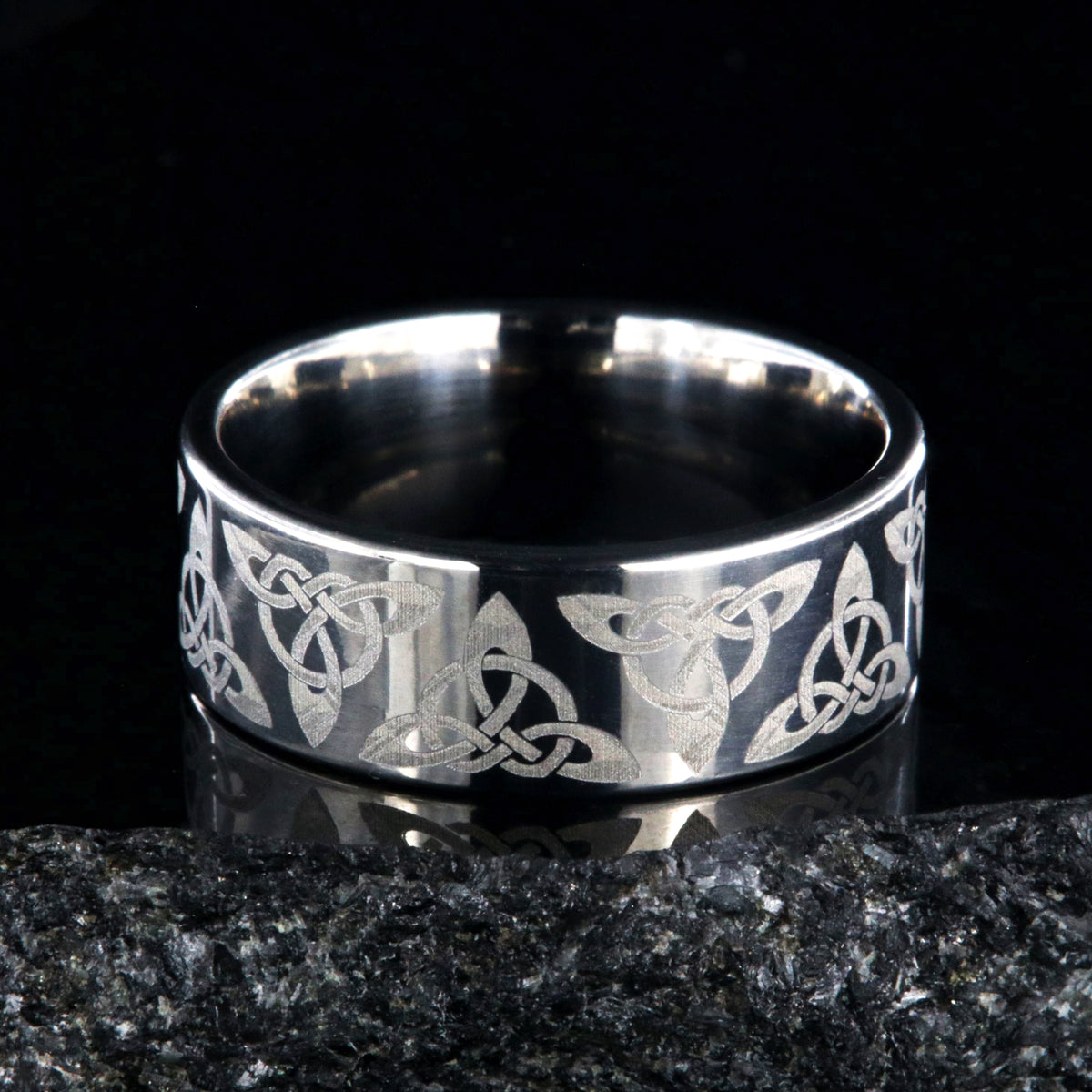 8mm wide titanium ring with a Celtic trinity know design and a flat profile