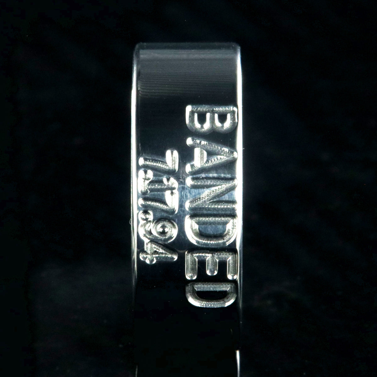 8mm wide titanium duck band wedding ring with 2 lines of text