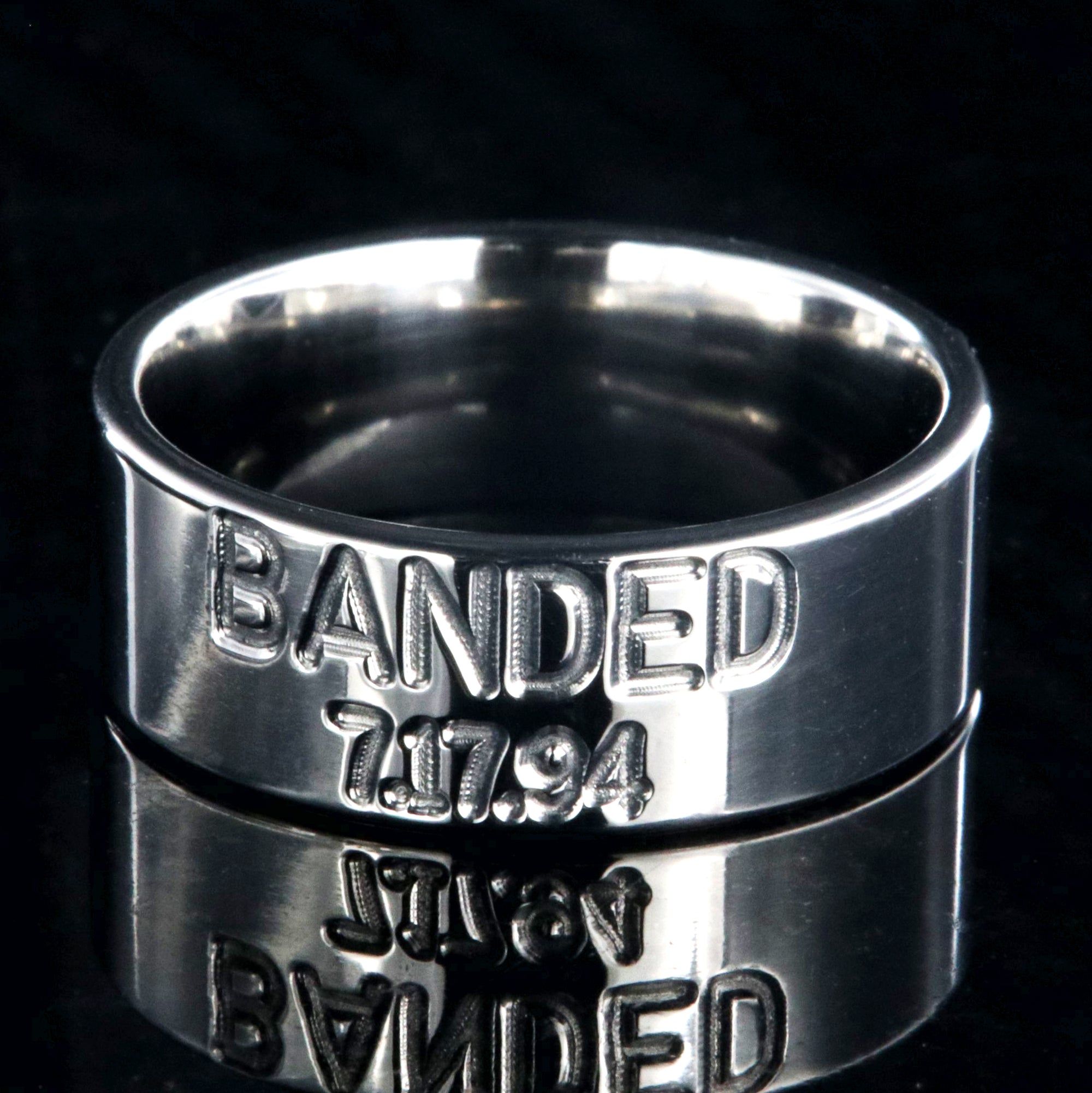 8mm wide titanium duck band wedding ring with 2 lines of text