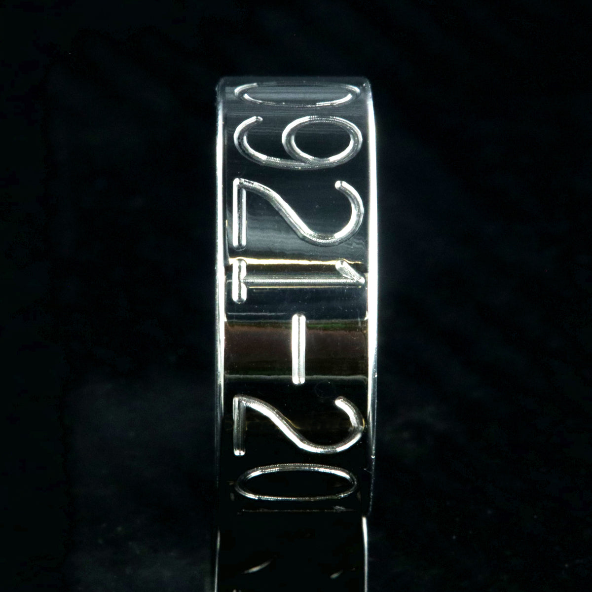 8mm wide titanium duck band with two lines of text adjacent to a large line of numbers, flat profile