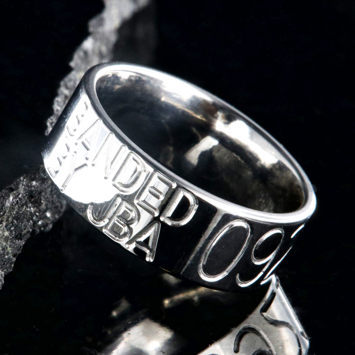 8mm wide titanium duck band with two lines of text adjacent to a large line of numbers, flat profile