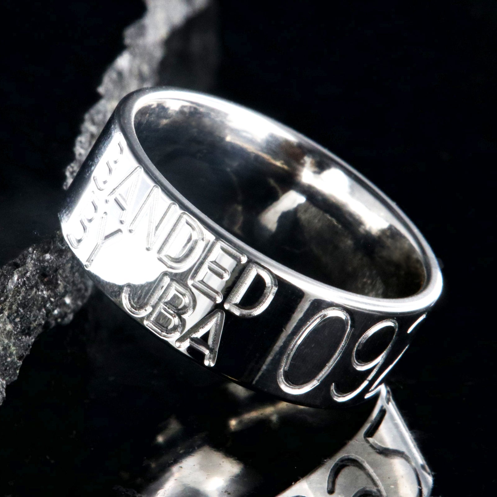 8mm wide titanium duck band with two lines of text adjacent to a large line of numbers, flat profile