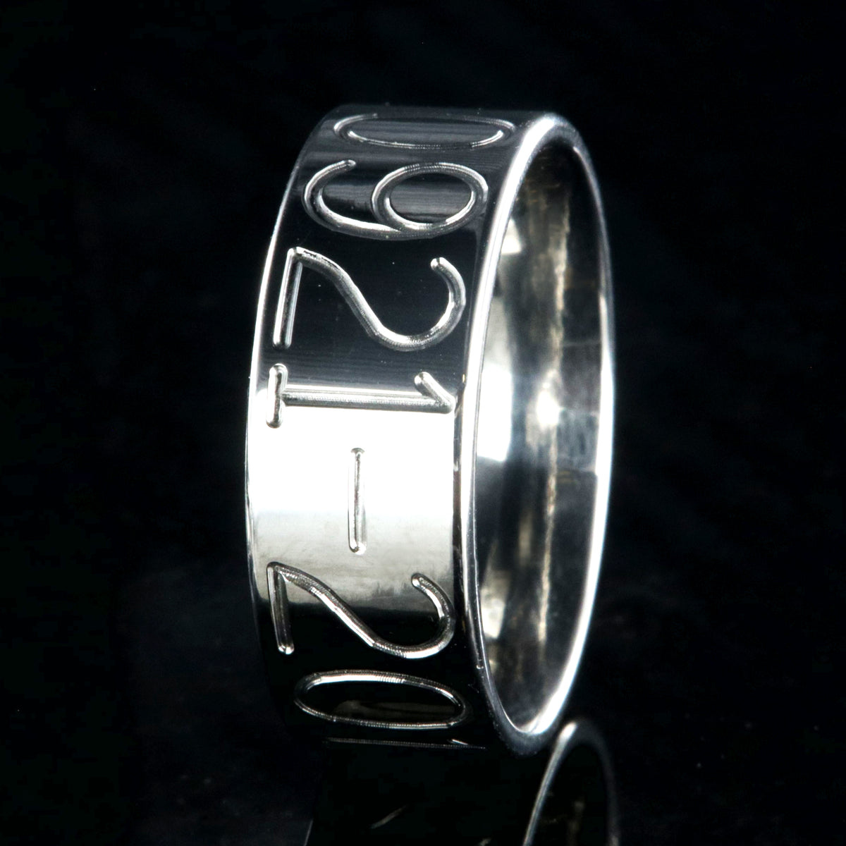 8mm wide titanium duck band with two lines of text adjacent to a large line of numbers, flat profile