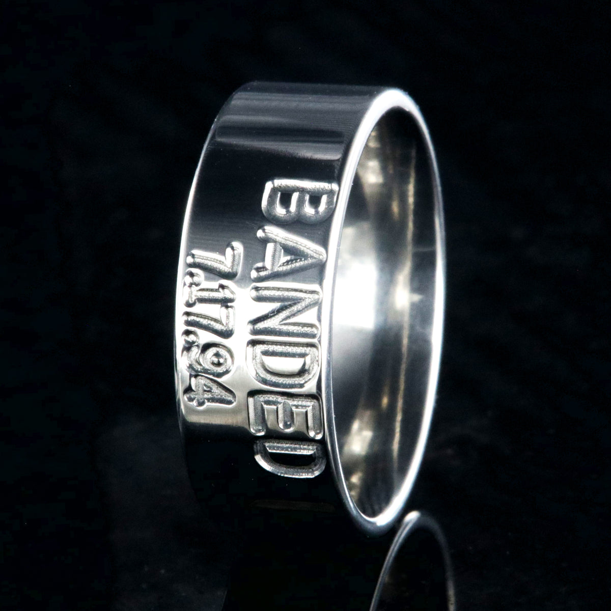 8mm wide titanium duck band wedding ring with 2 lines of text