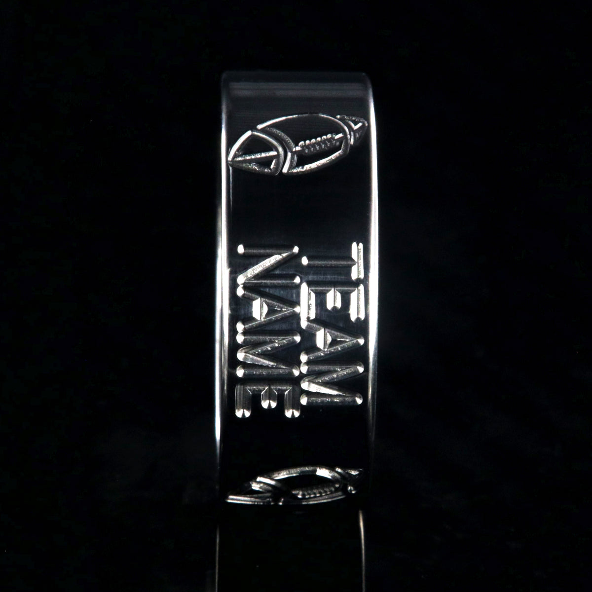 8mm wide titanium football ring with milled footballs and a custom team name