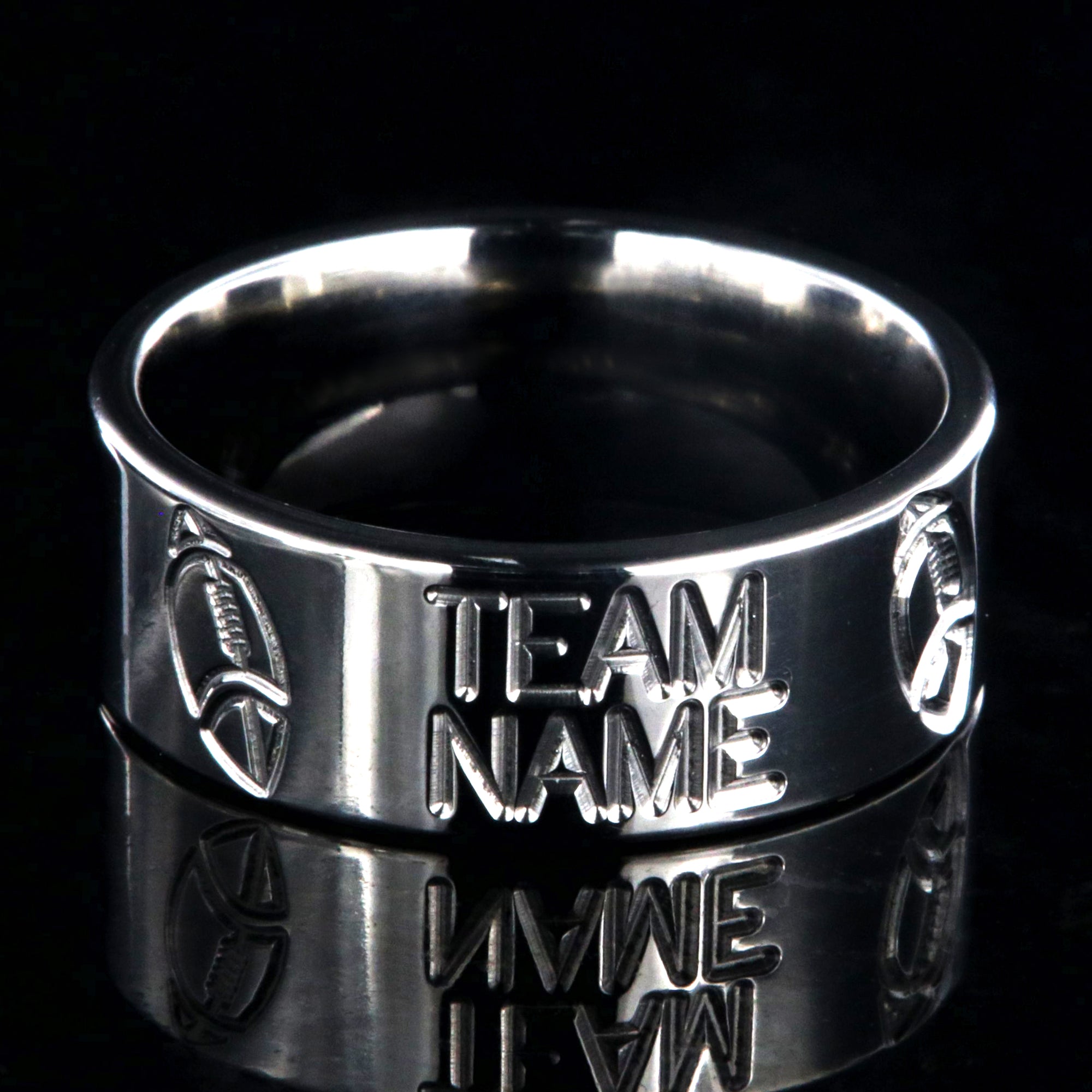8mm wide titanium football ring with milled footballs and a custom team name