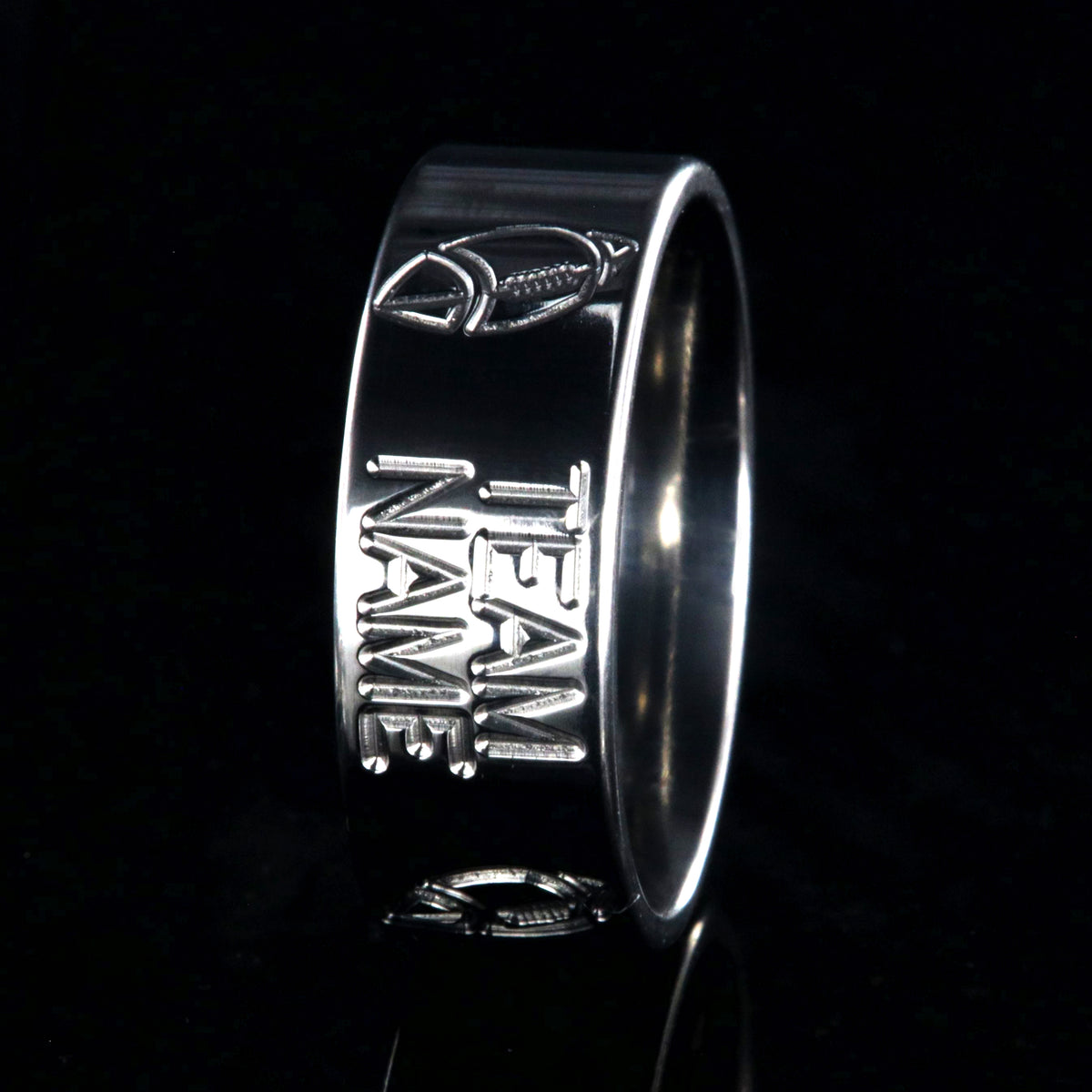 8mm wide titanium football ring with milled footballs and a custom team name
