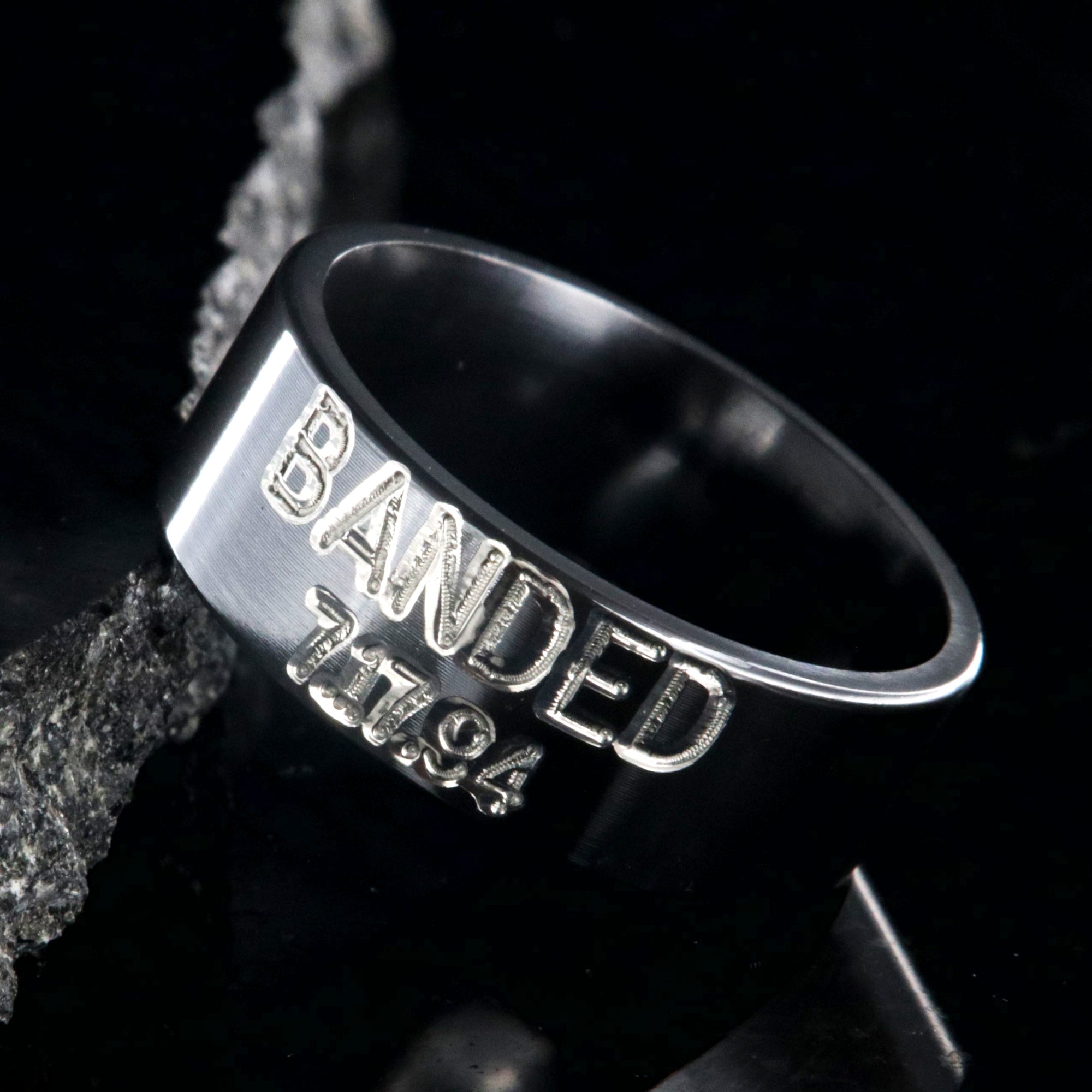 8mm wide black zirconium duck band ring with 2 lines two-tone colored text