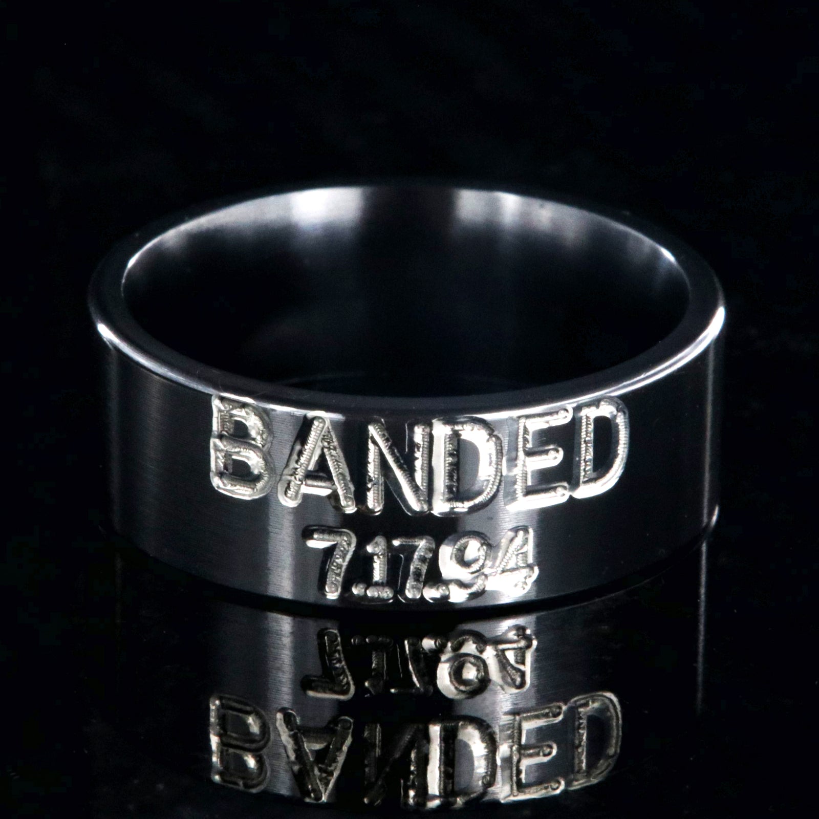 8mm wide black zirconium duck band ring with 2 lines two-tone colored text